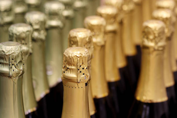 istock Sparkling wine bottles in golden foil for celebration 1293326461