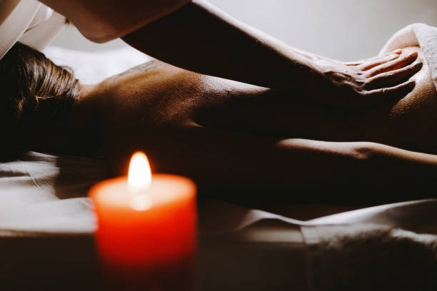 istock Young woman relaxing during back massage at the spa 1293327569