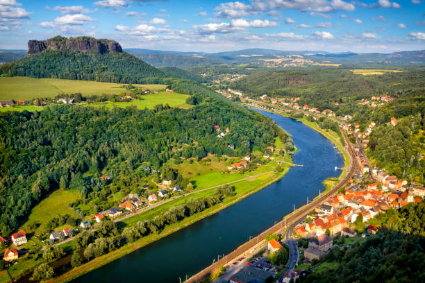 Vacations in Germany - River Elbe and Lilienstein in Saxon Switzerland View from Konigstein Fortress on river Elbe, town Konigstein and Lilienstein in Saxon switzerland, Germany elbe river stock pictures, royalty-free photos & images