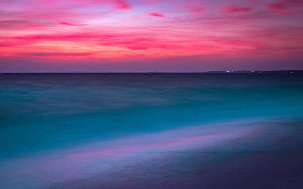 istock Twilight Seascape with Soft Turquoise Colored Sea Waves in Winter on Cape Cod Beach 1293327719