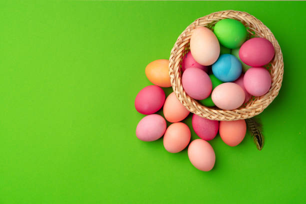 istock Easter eggs in a nest on green background 1293327941