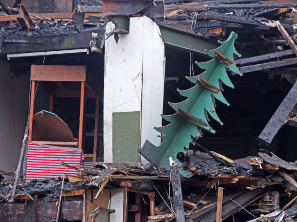 istock burned ruined collapsing collapsing retail building with destroyed Christmas tree display 1293328574