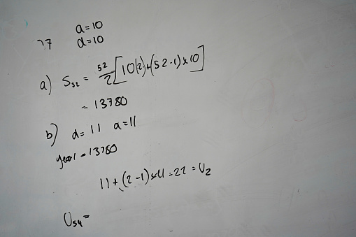 Maths equations on a classroom whiteboard