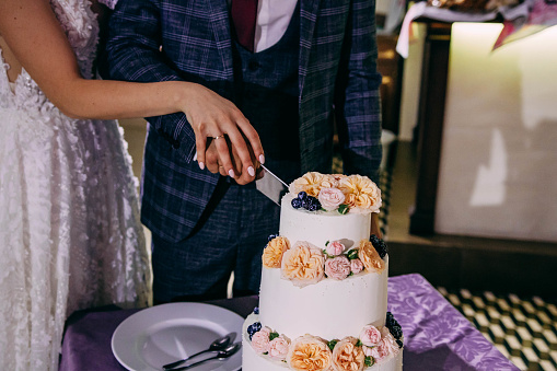 Cake cutting at a wedding reception
