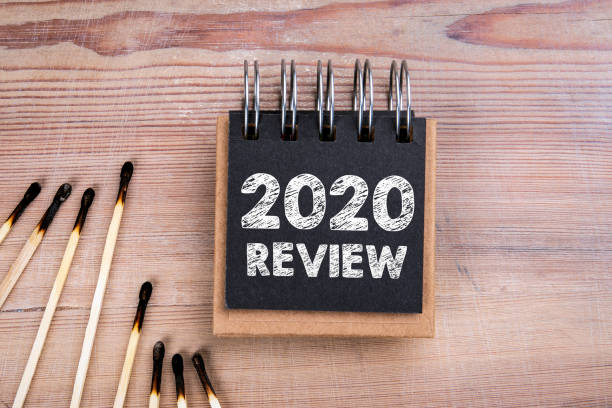 istock 2020 Review. Burnt matches and notebook on a wooden table 1293331049