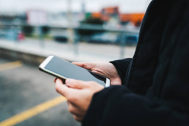 istock Unrecognizable man using his smart phone close up photo. 1293332133