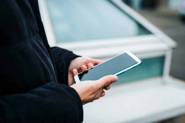 istock Unrecognizable man using his smart phone close up photo. 1293332134
