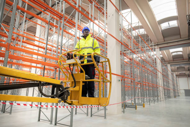 istock Warehouse worker during his job on height access platform 1293333972