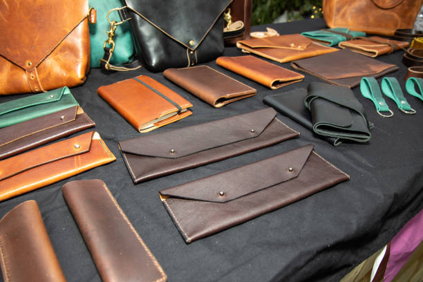 istock A selection of leather wallets and other leather goods on a table 1293334081