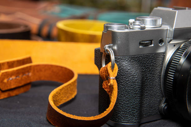 istock An old retro vintage camera with a brown leather strap 1293334379