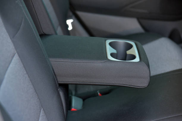 istock Armrest in the car with cup holder for rear seats row 1293335210
