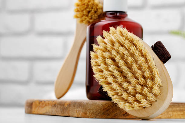 istock Liquid soap container and massage brush in bathroom 1293335612
