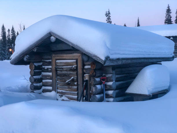 istock Landscape, Winter Lapland. Snow-covered log shed. 1293337043