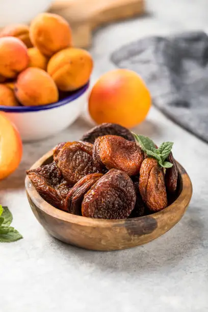 Photo of Dried apricots are popular in cooking, sweet dried fruit, healthy food, compote making.