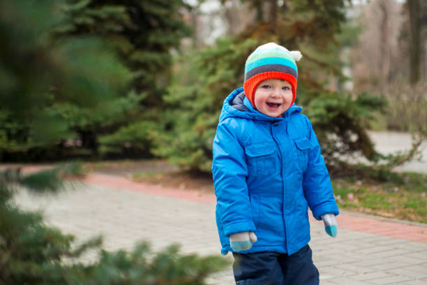 istock Child walking  near christmas tree 1293339050