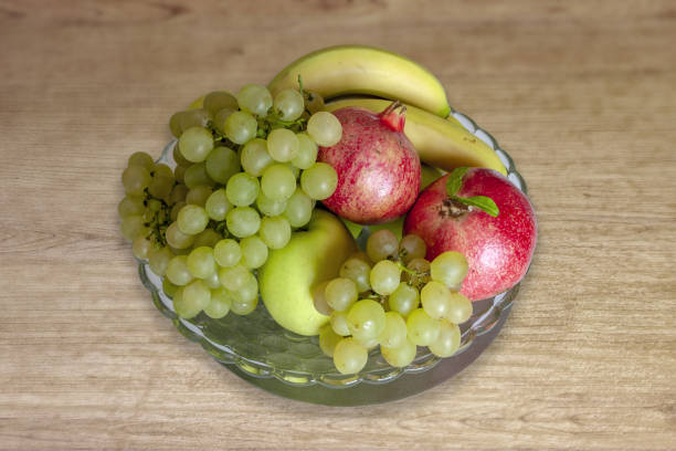 istock Mixed fruit season, banana, pomegranate, grapes, apple. 1293339408