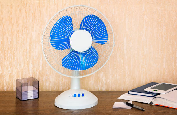 istock Convenient fan with a switch on the Desk 1293341453