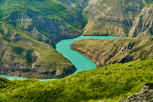 A bright green blue winding river in the mountains.Sulak canyon, Dagestan, chirkeyskaya HPP, buinaksky district.