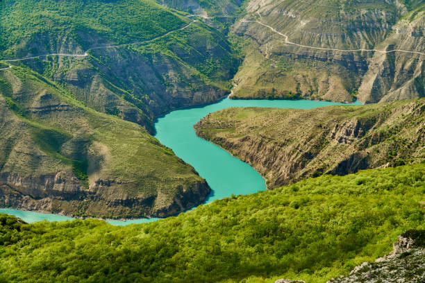 A bright green blue winding river in the mountains.Sulak canyon, Dagestan A bright green blue winding river in the mountains.Sulak canyon, Dagestan, chirkeyskaya HPP, buinaksky district. north caucasus photos stock pictures, royalty-free photos & images