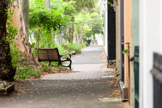 Old alley with park bench in the town, background with copy space, full frame horizontal composition