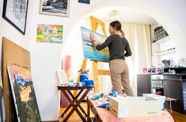 istock Young painter creates in her studio at home stock photo 1293356364