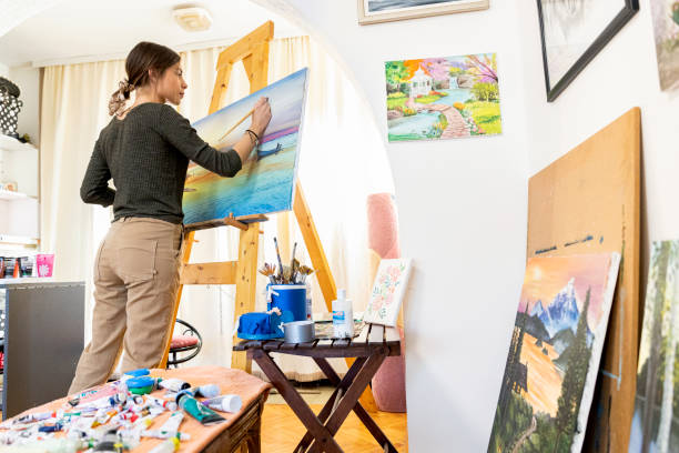 istock Young painter creates in her studio at home stock photo 1293356387