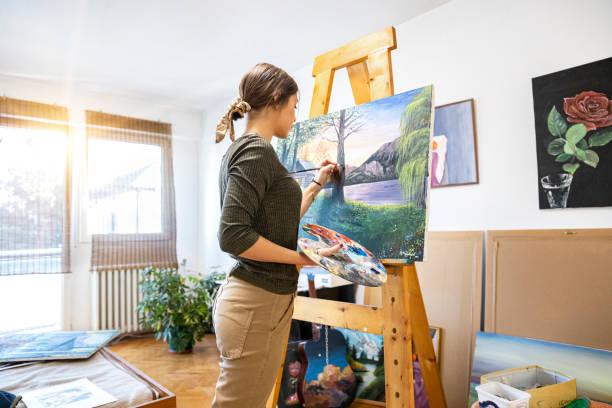 istock Young painter creates in her studio at home stock photo 1293356501