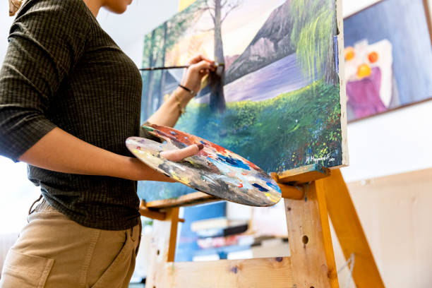 istock Young painter creates in her studio at home stock photo 1293356536