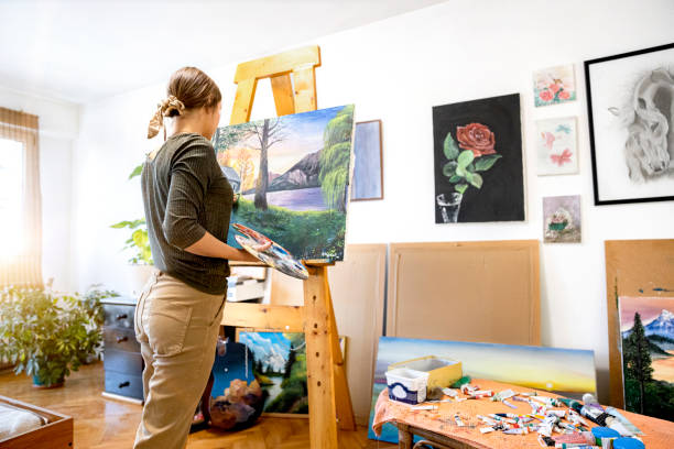 istock Young painter creates in her studio at home stock photo 1293356697