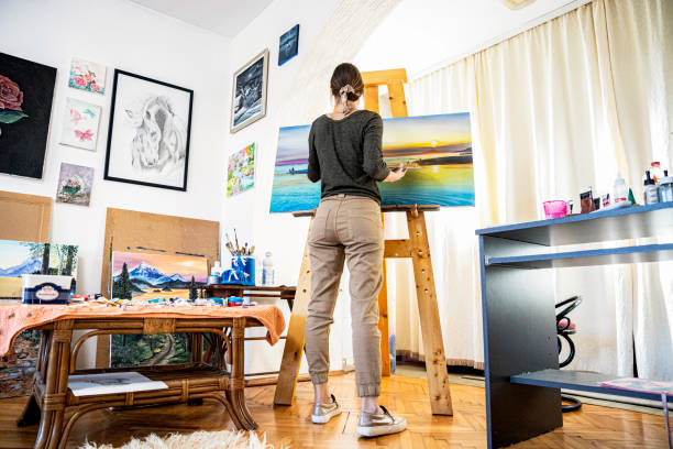 istock Young painter creates in her studio at home stock photo 1293357325