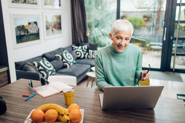 istock Senior entrepreneur working from home 1293359280