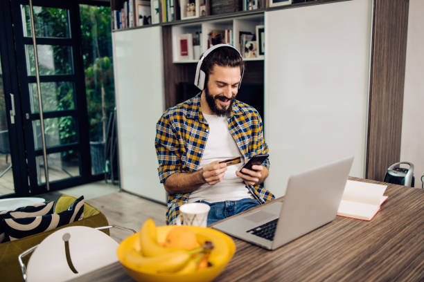 istock Portrait of a young man ordering something online 1293360291
