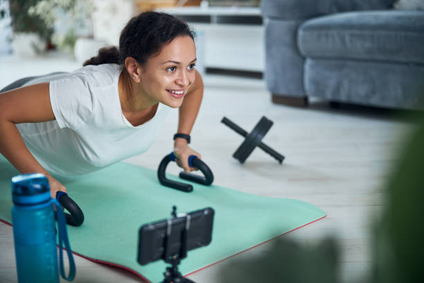 istock Beautiful smiling woman performing a strength exercise 1293363128
