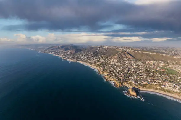 Aerial view of the Laguna Beach coast with stormy sky in Orange County, California.