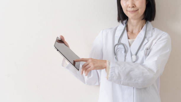 istock Female doctor with tablet 1293365319