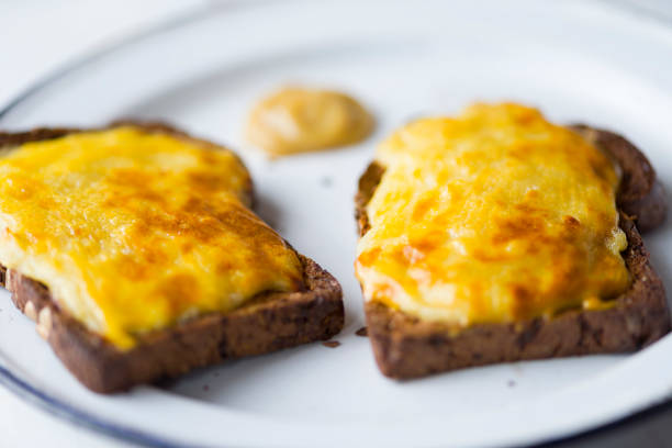 close up of english pub grub welsh rarebit cheese sauce toast