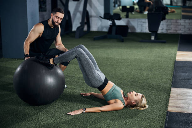 istock Sportsperson doing a hamstring curl on a fitness ball 1293366037