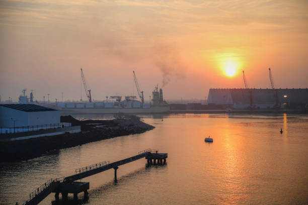 Sunrise over the port of Quetzal in Guatemala Quetzal, Guatemala - April 10, 2017: Sunrise over the port of Quetzal in Guatemala puerto quetzal guatemala stock pictures, royalty-free photos & images