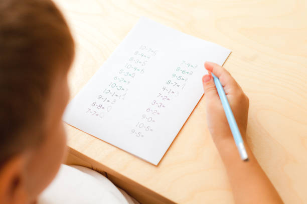 istock cute little boy learning at home. 1293369335