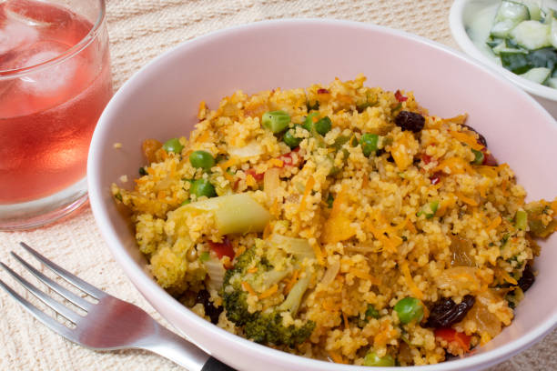 istock Bowl with Moroccan couscous accompanied by red fruit drink 1293369511