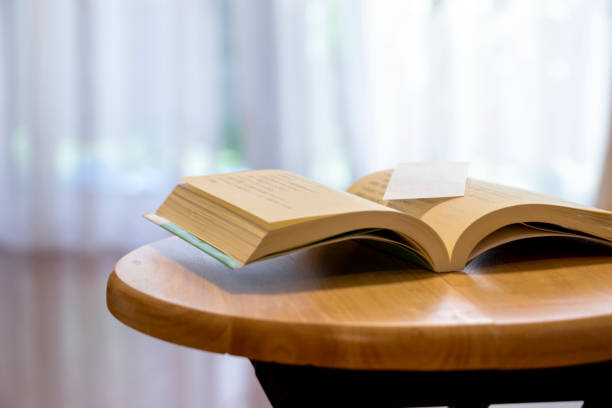 Opened book on the wooden desk