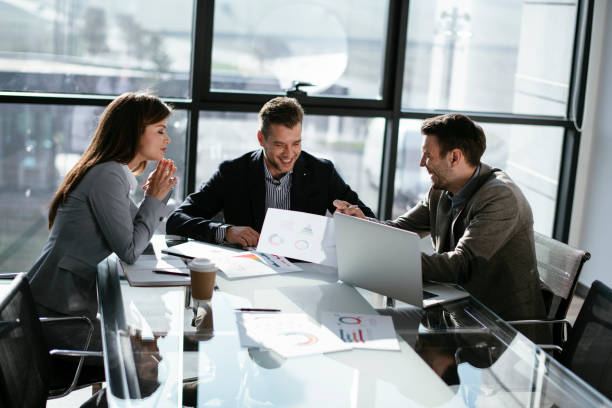 istock Business people discussing new business projects in the office. 1293371390