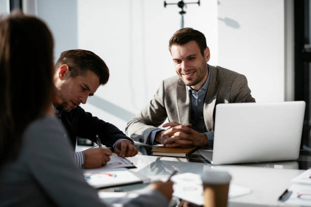 istock Business people discussing new business projects in the office. 1293371422