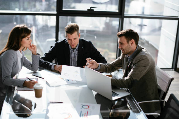 istock Business people discussing new business projects in the office. 1293372060