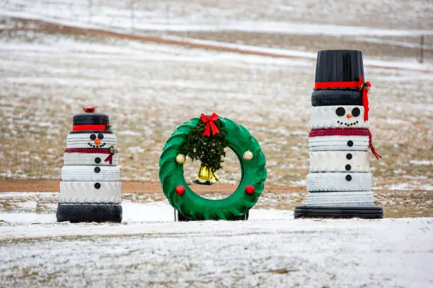 Photo of Snowmen and a wreath made out of recycled tires for Christmas decorations