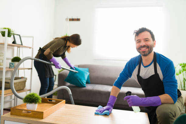 istock Happy man cleaning the house with his partner 1293372274