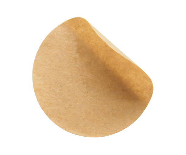 istock Brown round paper sticker label isolated on white background 1293373078