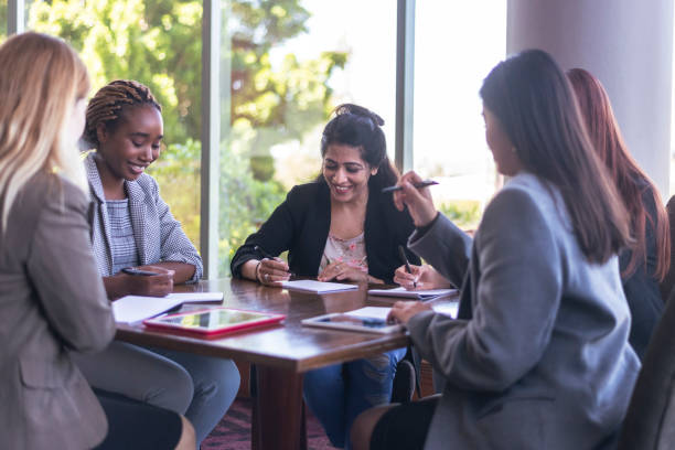 istock Ethnic female manager leading team meeting 1293373261