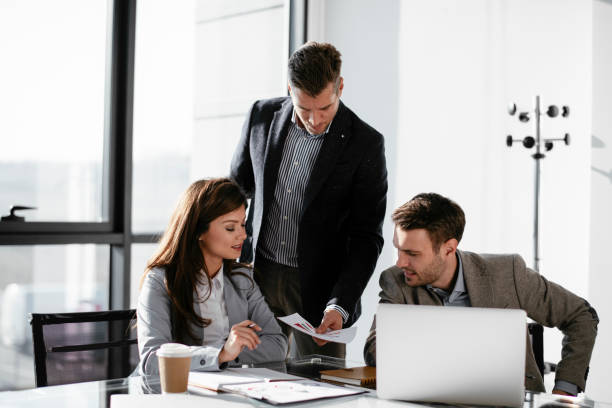 istock Business people discussing new business projects in the office. 1293373289
