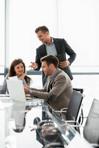 istock Business people discussing new business projects in the office. 1293373320